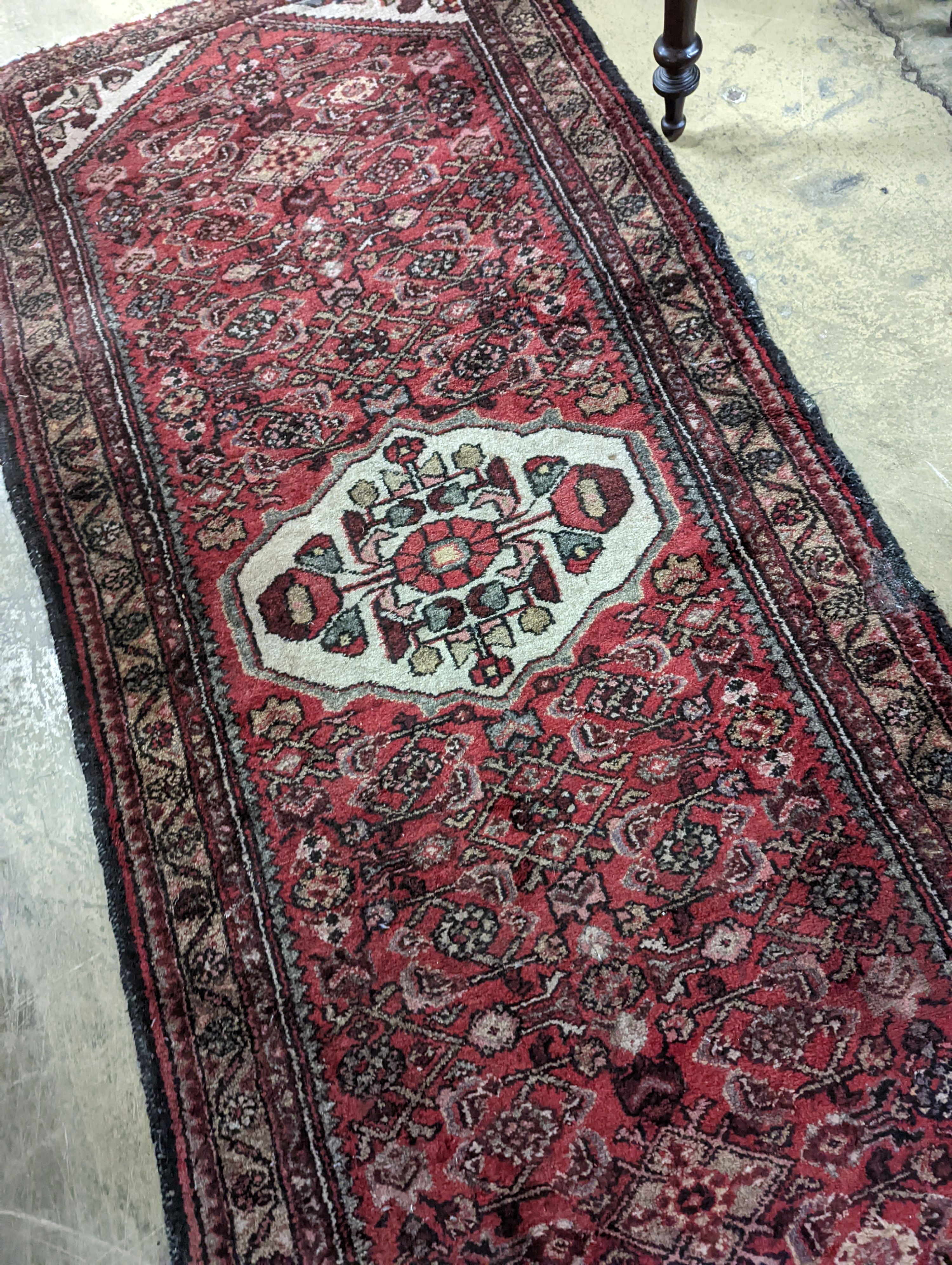 A Hamadan red ground rug, 190 x 82cm